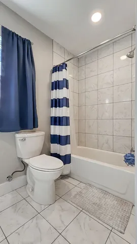 a bathroom with a toilet a sink and a bathtub