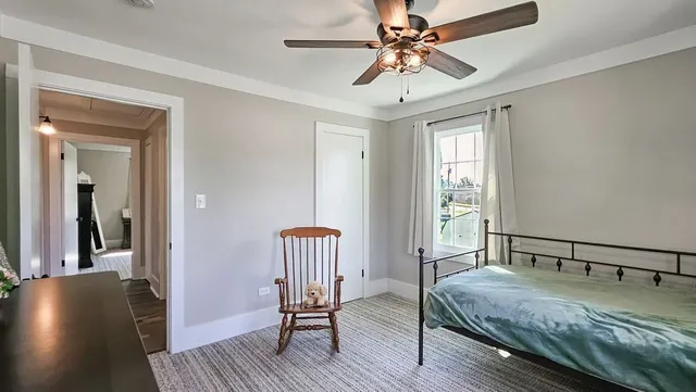 a bedroom with furniture and a window