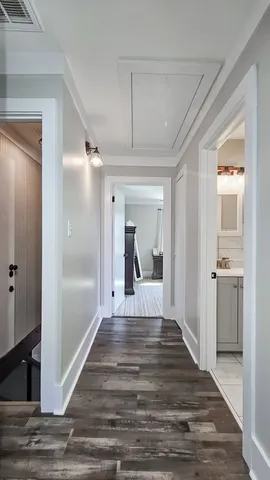 a view of a hallway view with wooden floor and staircase