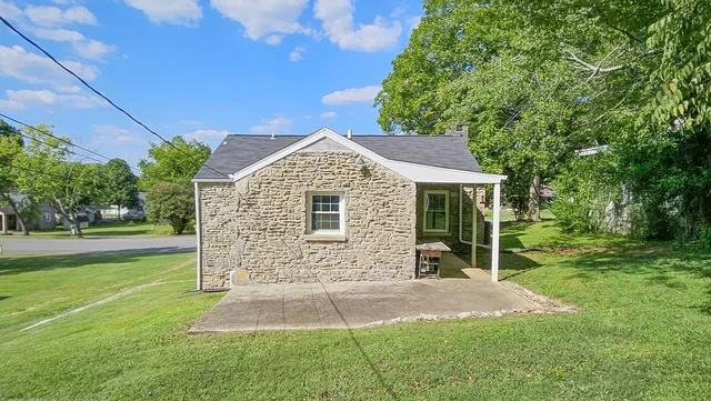 a front view of a house with outdoor seating