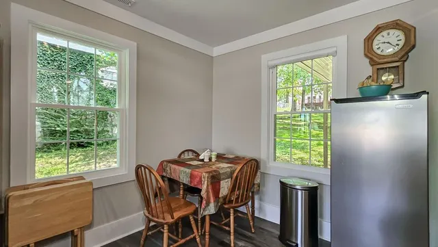 a view of a dining room with furniture window and outside view
