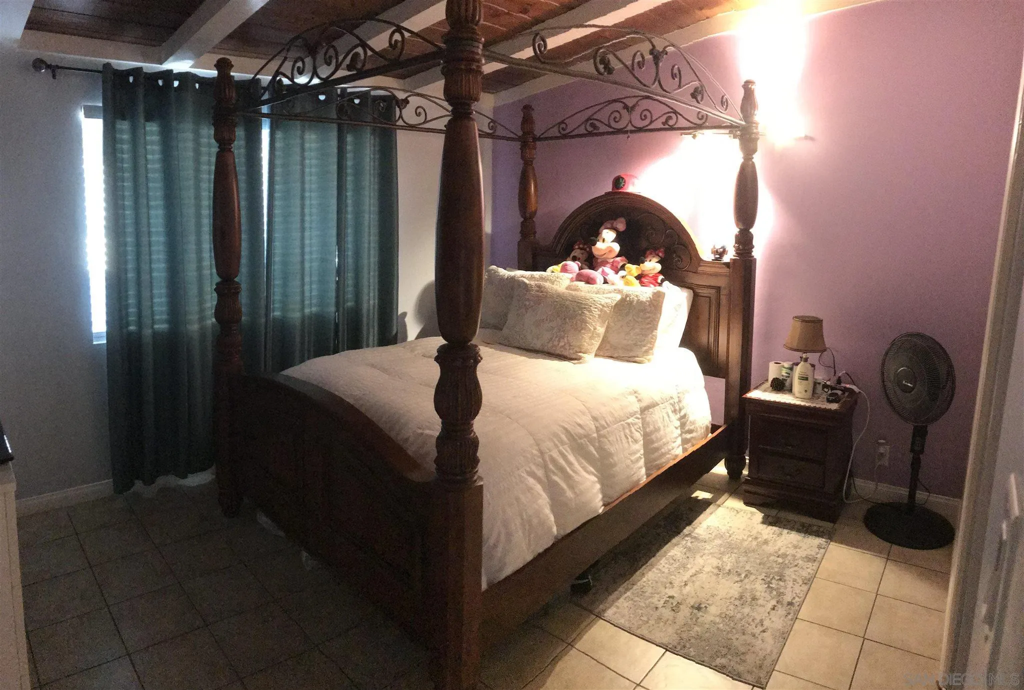 395-397 Eddie Drive Vista, CA 92083 - Photo 11 of 30 a bedroom with a bed and a mirror