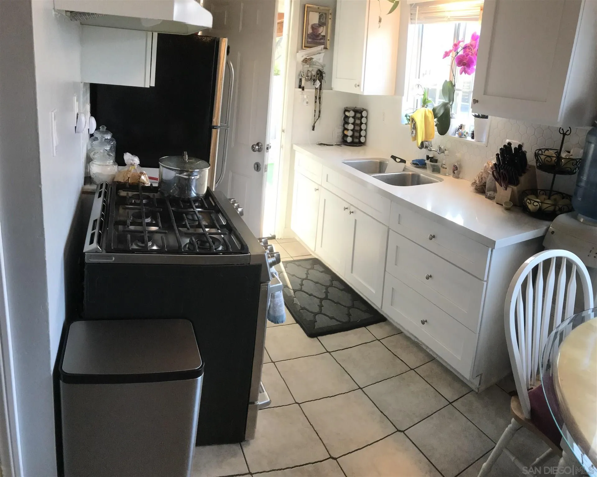 395-397 Eddie Drive Vista, CA 92083 - Photo 13 of 30 a kitchen with a sink appliances and cabinets