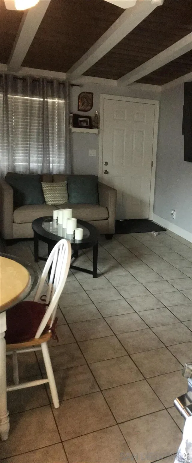 395-397 Eddie Drive Vista, CA 92083 - Photo 14 of 30 a living room with furniture a rug and outdoor space