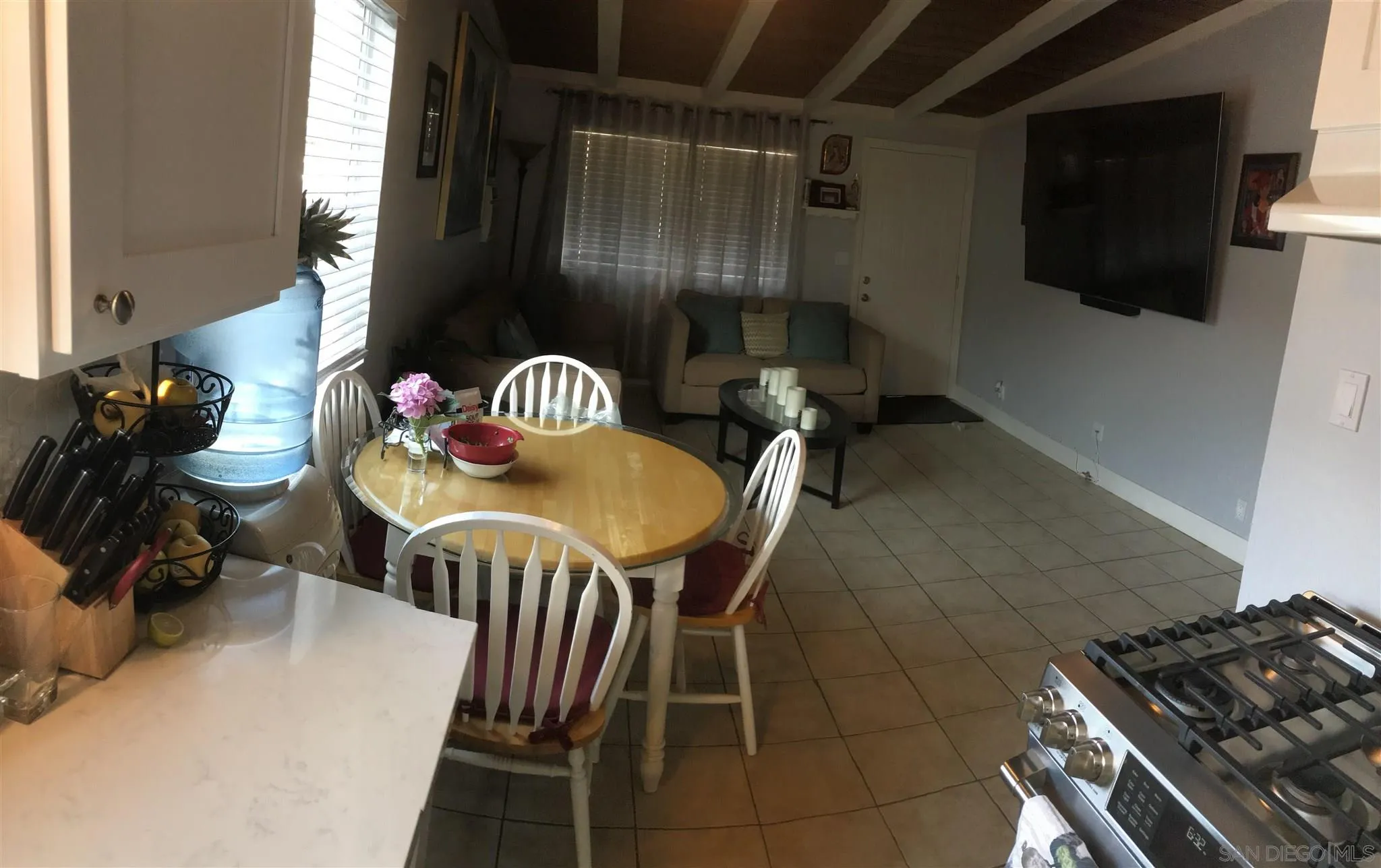 395-397 Eddie Drive Vista, CA 92083 - Photo 16 of 30 a kitchen with a sink a stove and a refrigerator