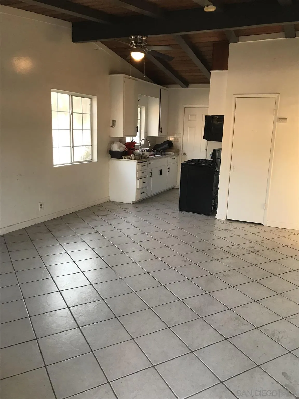 395-397 Eddie Drive Vista, CA 92083 - Photo 17 of 30 a kitchen with stainless steel appliances granite countertop a stove a sink and a microwave