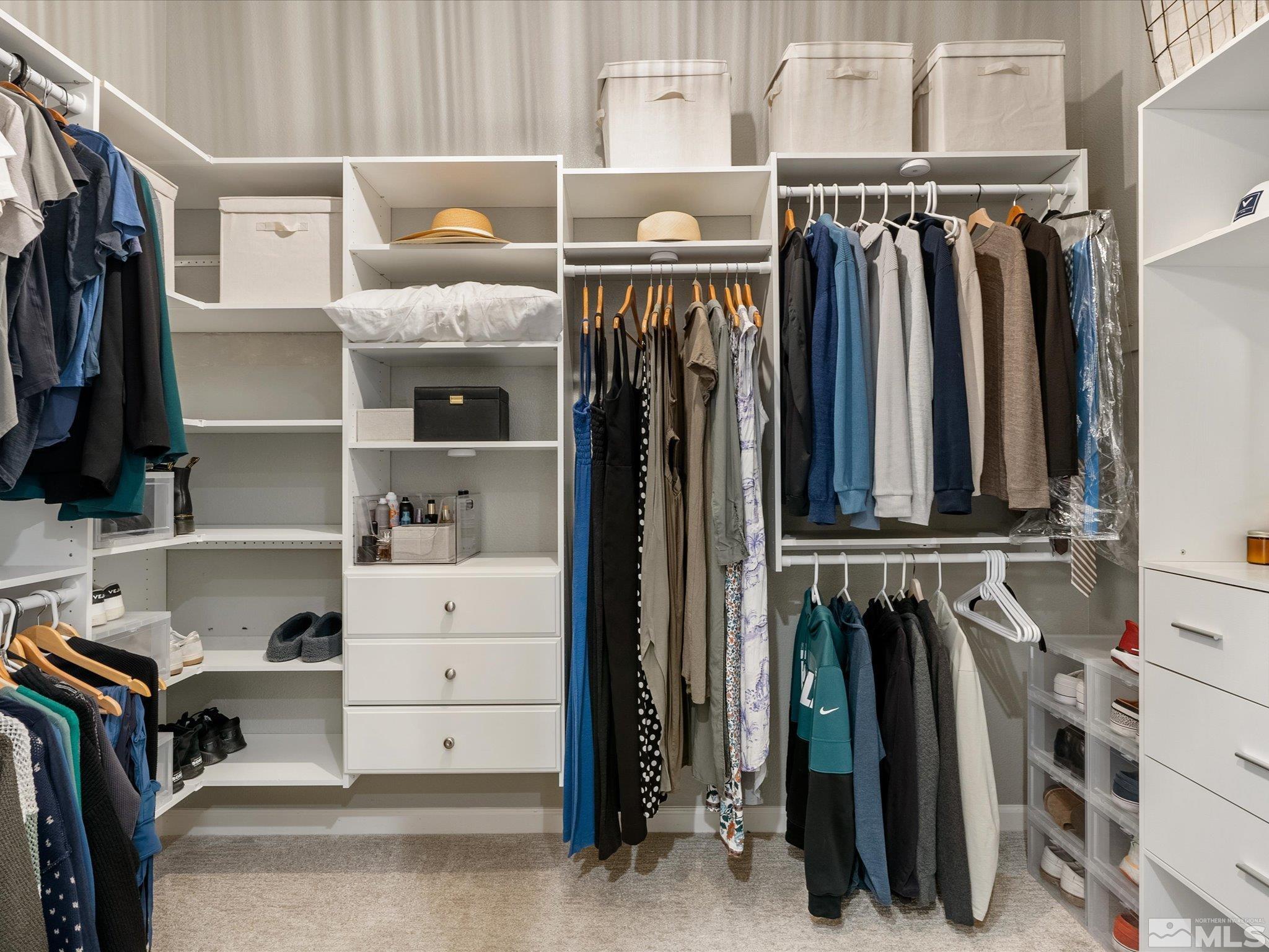15033 Iron River Drive Reno, NV 89521 - Photo 29 of 39 a view of walk in closet with clothes and shoes