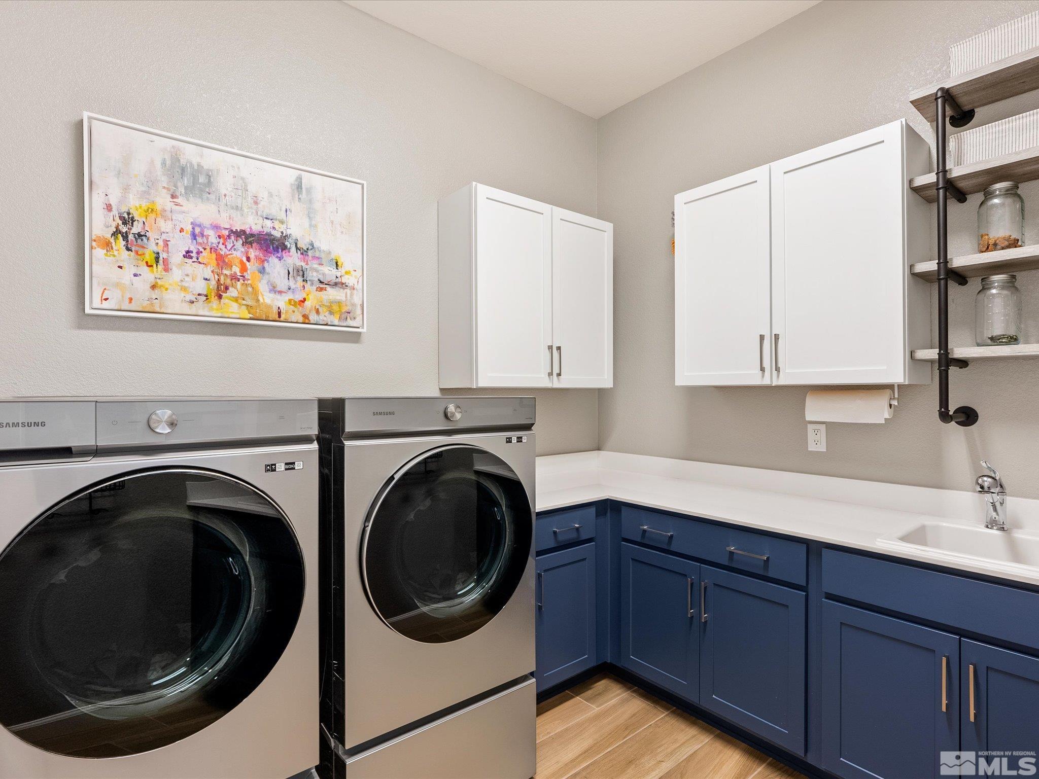 15033 Iron River Drive Reno, NV 89521 - Photo 35 of 39 a utility room with sink dryer and washer
