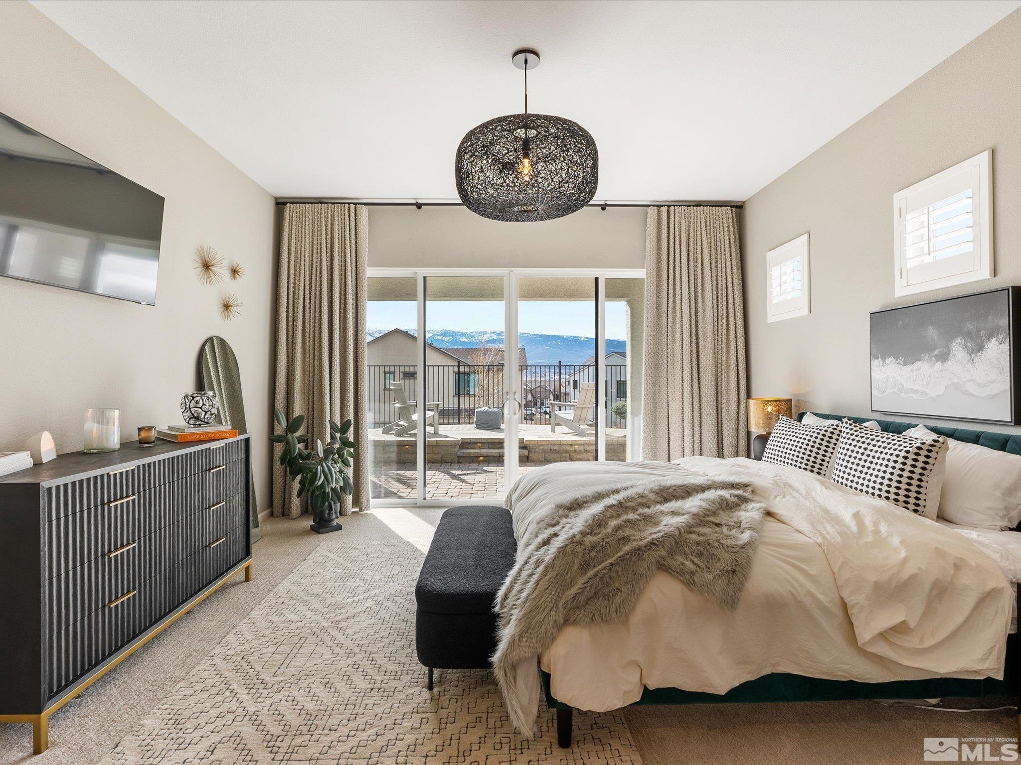 15033 Iron River Drive Reno, NV 89521 - Photo 39 of 39 a bedroom with a bed and a large window