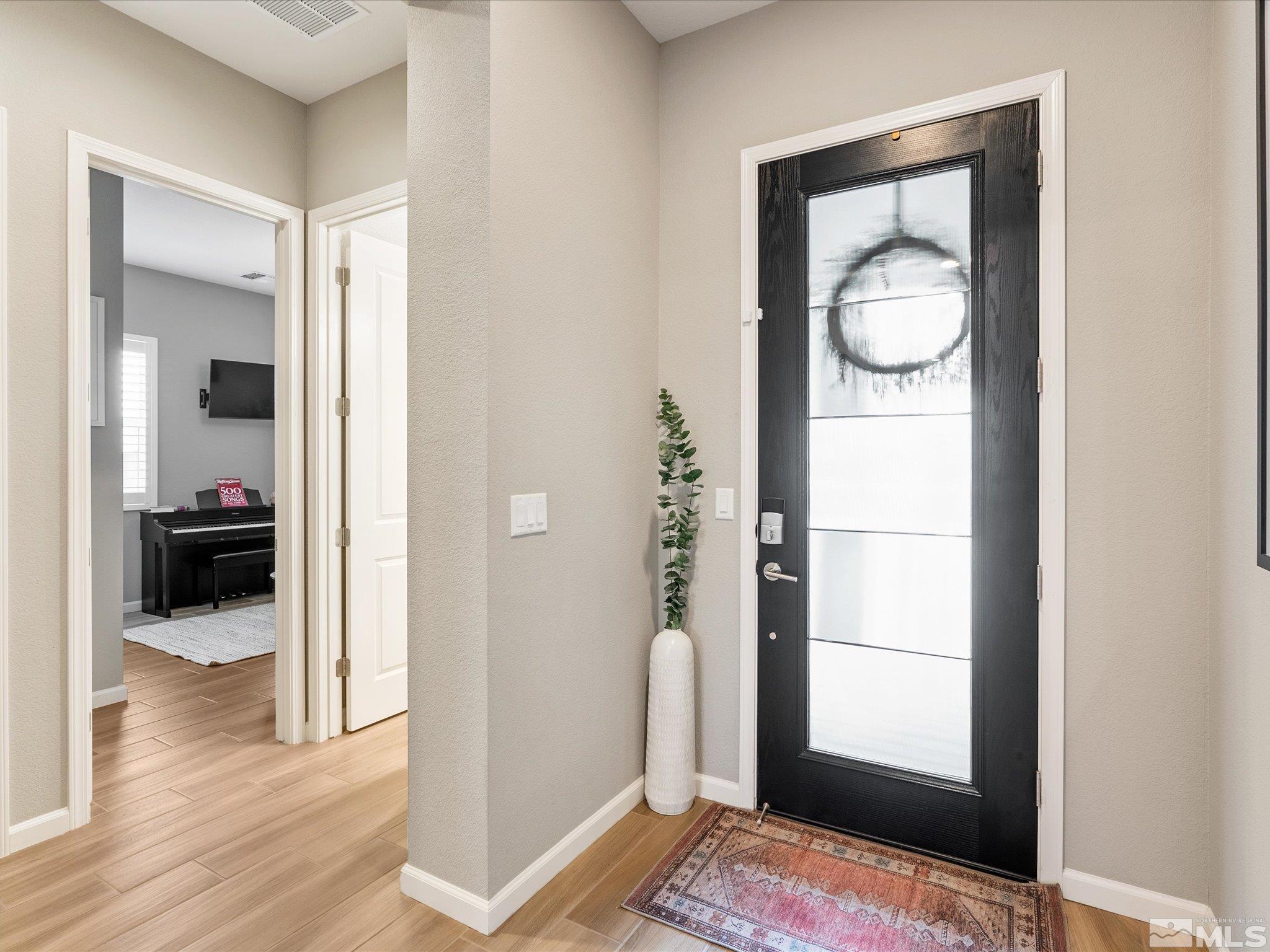 15033 Iron River Drive Reno, NV 89521 - Photo 10 of 39 a view of a bedroom from a hallway