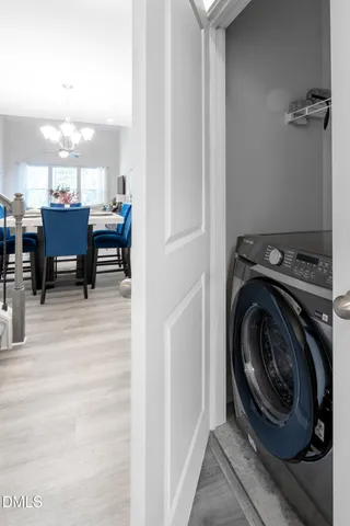 a view of a hallway with washer and dryer