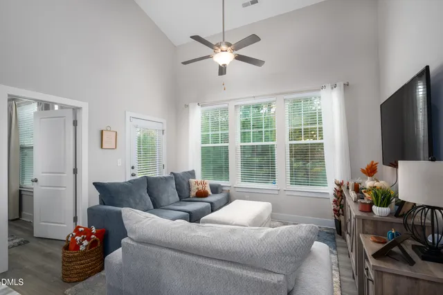 a living room with furniture and a large window