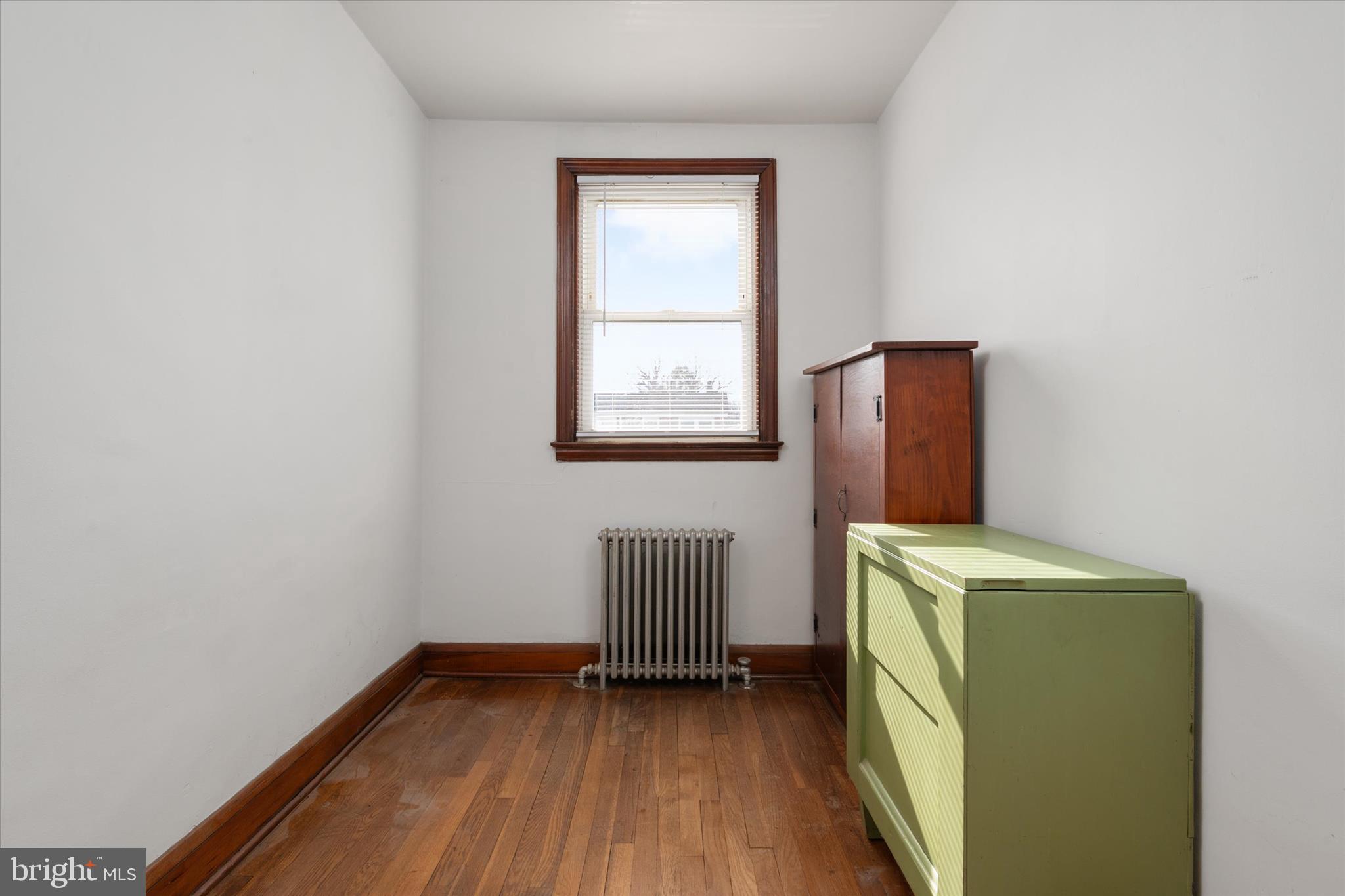 336 Arden Road West Baltimore, MD 21225 - Photo 12 of 21 a room with a window and wooden floor