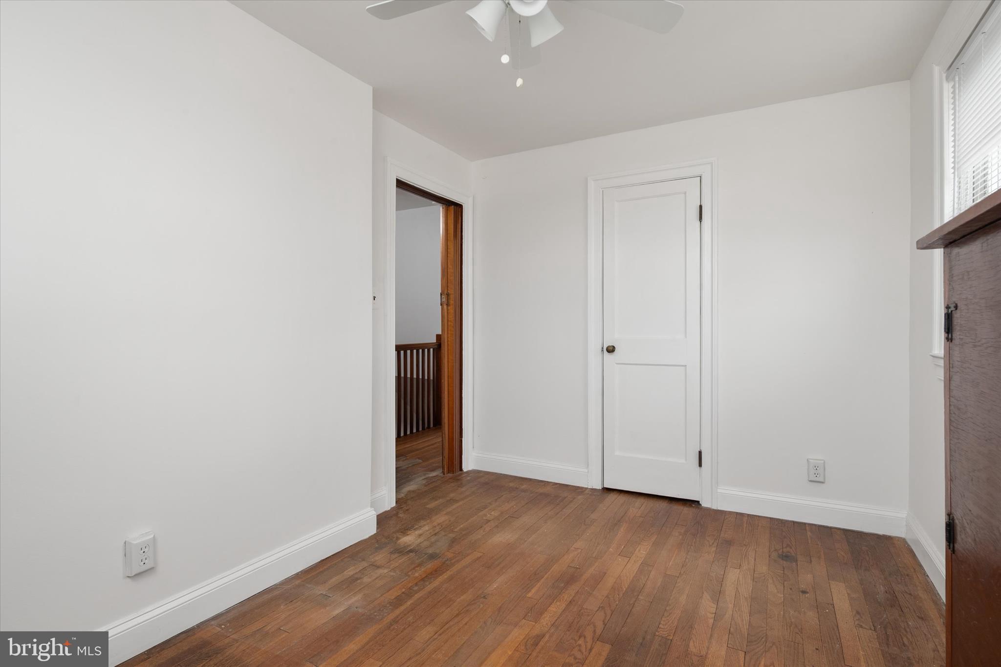 336 Arden Road West Baltimore, MD 21225 - Photo 19 of 21 a view of an empty room with wooden floor