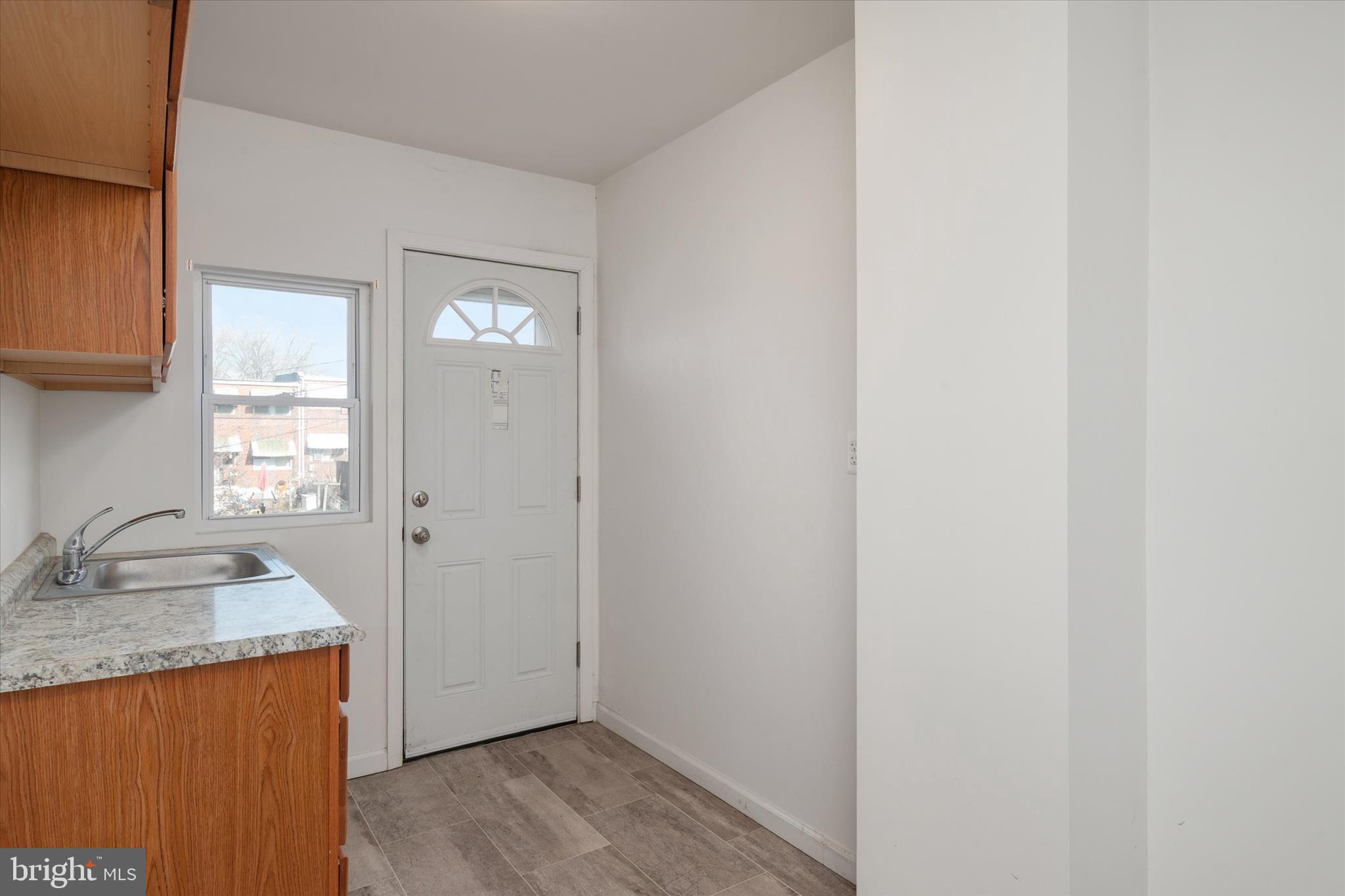 336 Arden Road West Baltimore, MD 21225 - Photo 7 of 21 a bathroom with a granite countertop sink and a mirror