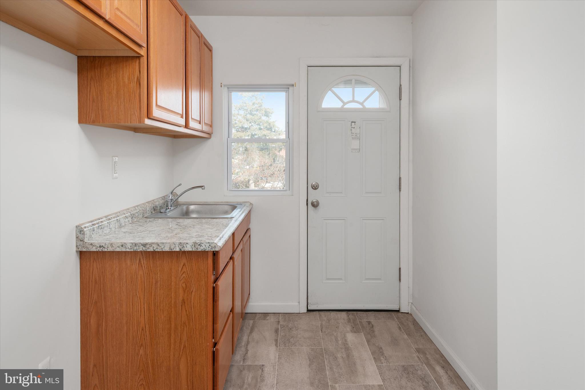336 Arden Road West Baltimore, MD 21225 - Photo 9 of 21 a bathroom with a granite countertop sink and a mirror