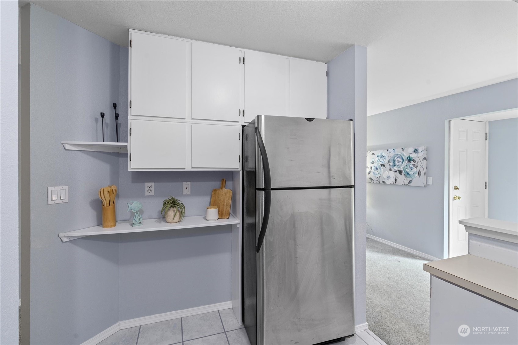 14919 54th Place West Edmonds, WA 98026 - Photo 14 of 33 a white refrigerator freezer sitting in a kitchen