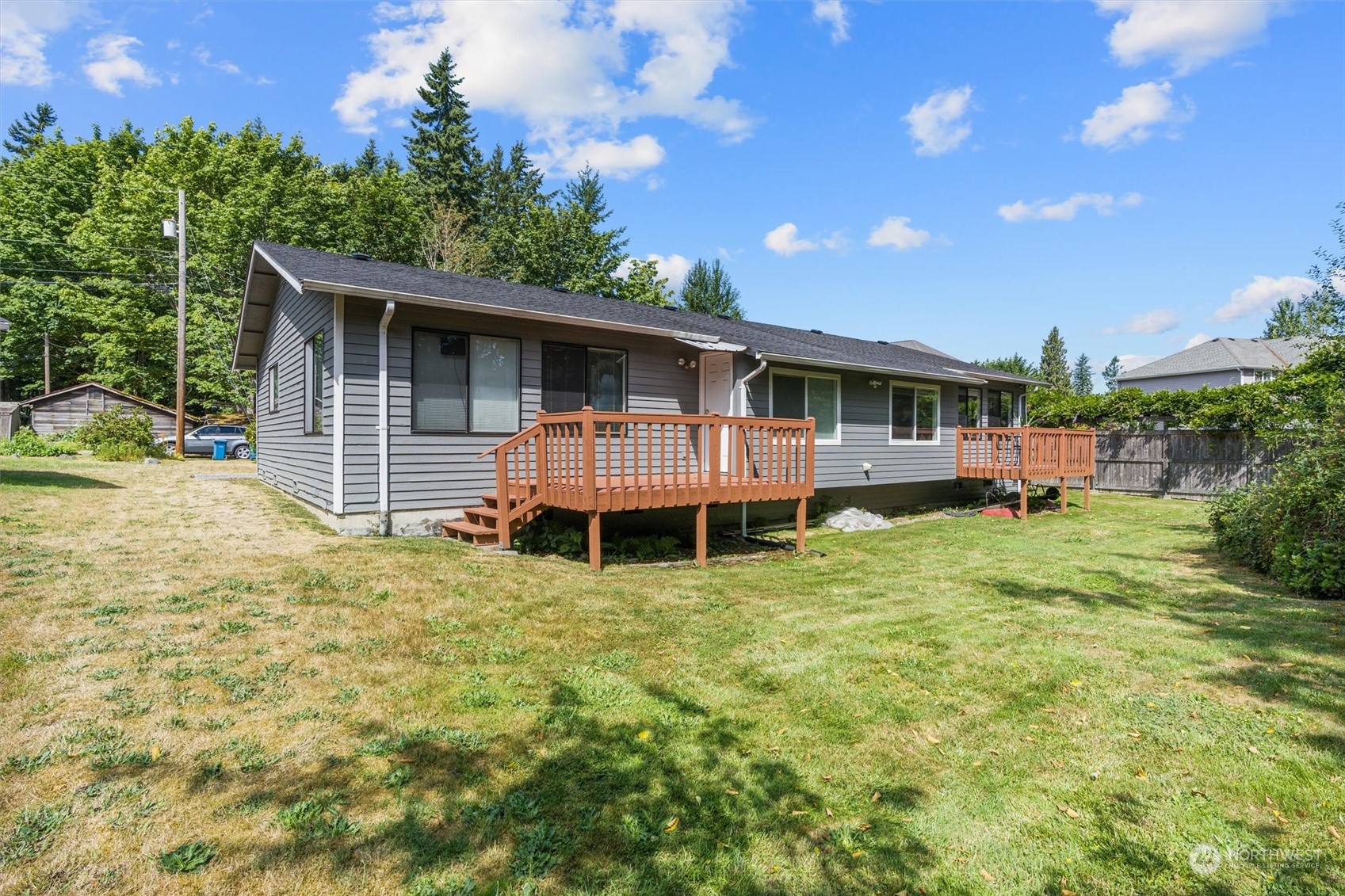 14919 54th Place West Edmonds, WA 98026 - Photo 27 of 33 a view of a house with a backyard and a patio