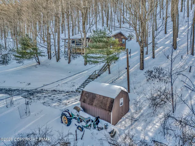 a view of a backyard with sitting area
