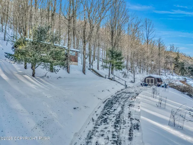 a view of swimming pool with a yard