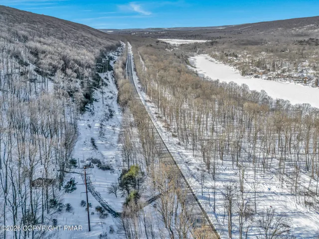 a view of a pathway with a dry yard