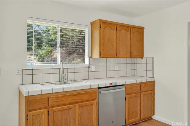 a bathroom with a sink a vanity and a window
