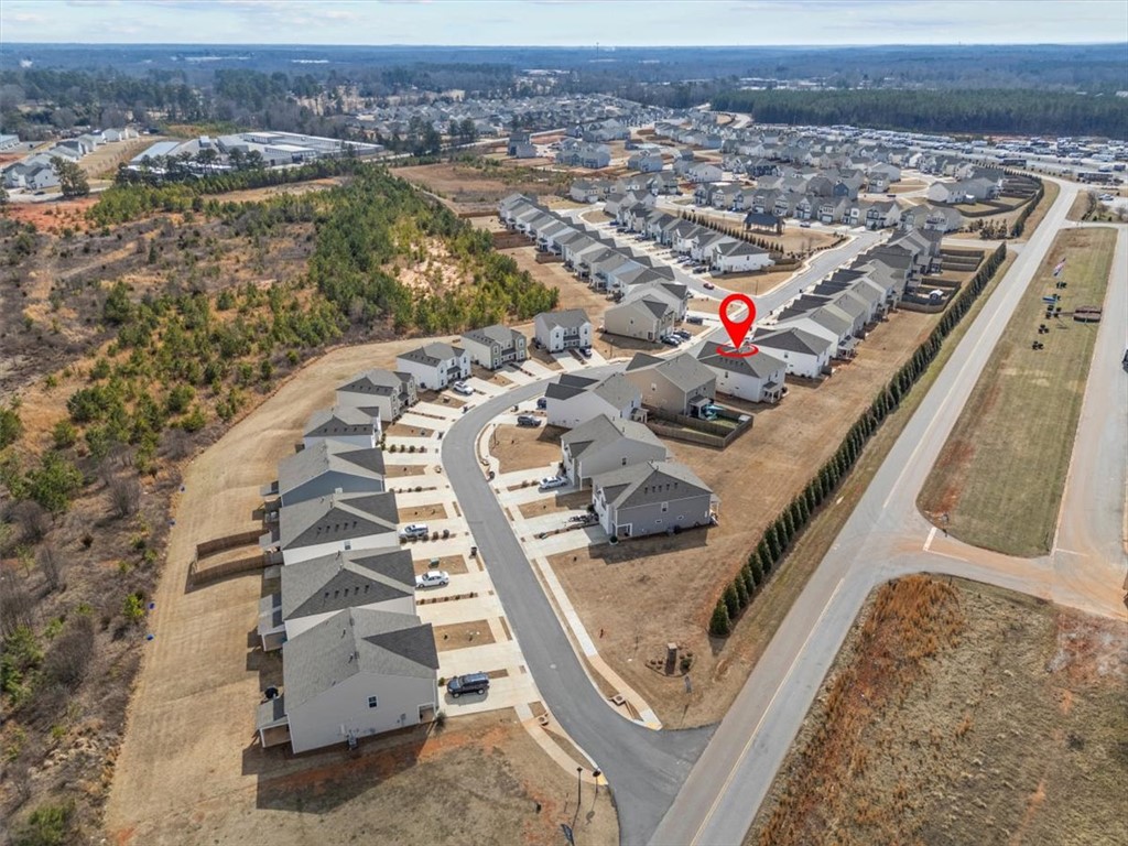 118 Adger Road Pendleton, SC 29670 - Photo 30 of 31 An aerial perspective reveals a vibrant community with houses nestled along winding roads.