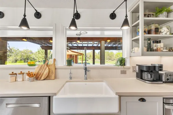 a bathroom with a sink and a large window