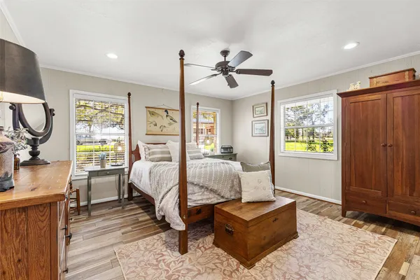 a bed room with bed and window