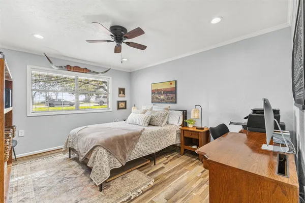 a bedroom with a bed and window