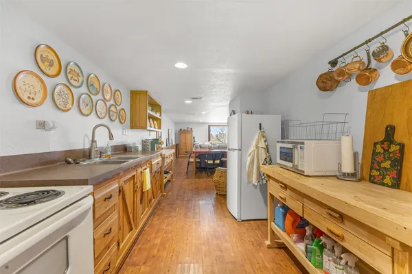 a kitchen with stainless steel appliances granite countertop a stove and a sink