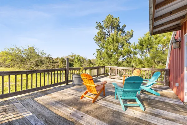 a view of a chair and table on the wooden floor