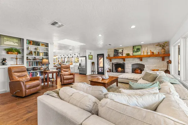a living room with furniture and a fireplace