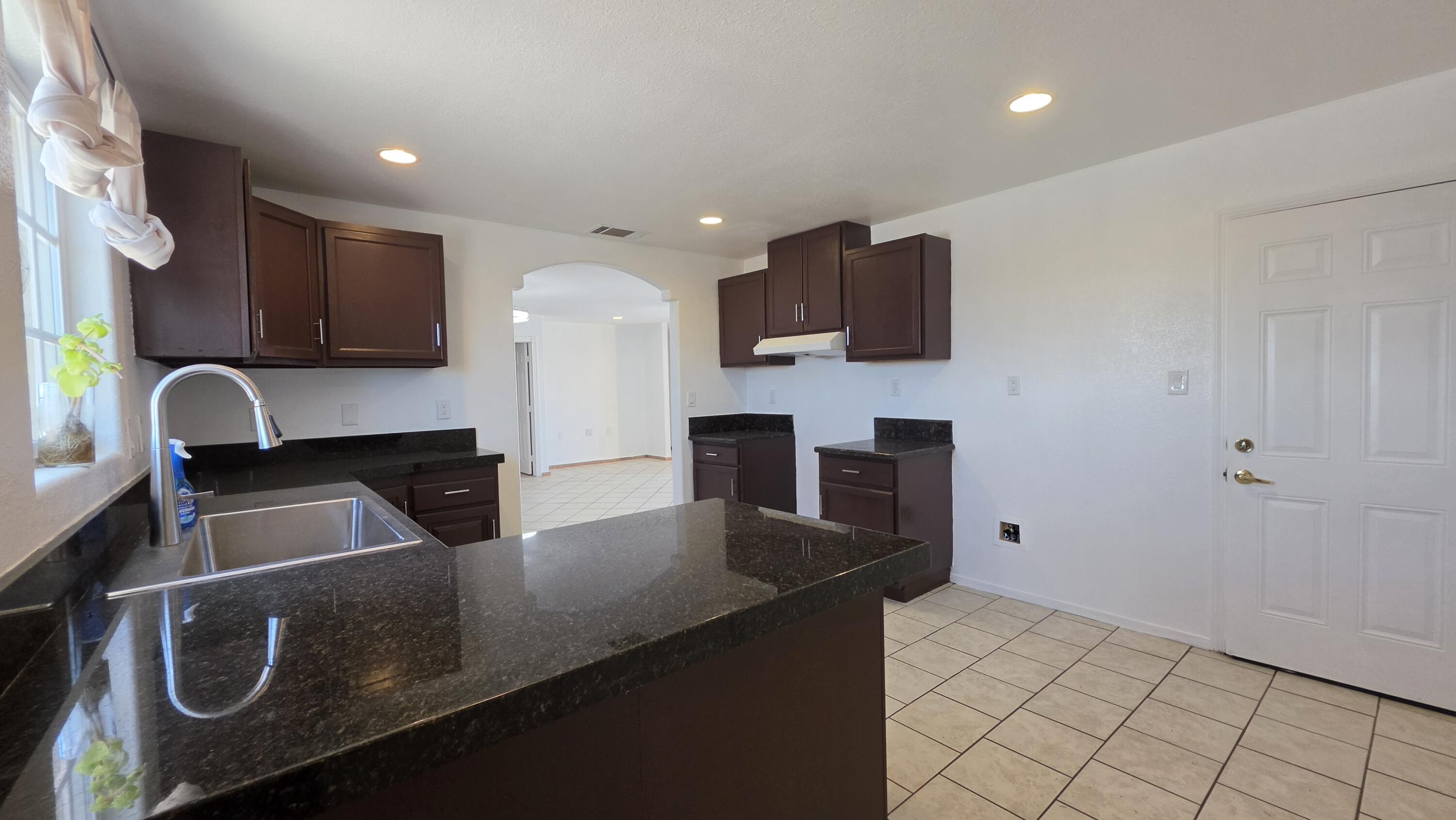 2778 Calhoun Street Thermal, CA 92274 - Photo 12 of 23 a kitchen with a sink cabinets and window