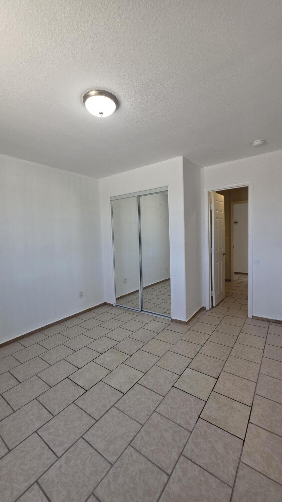 2778 Calhoun Street Thermal, CA 92274 - Photo 16 of 23 a view of a livingroom with an empty space and a more cabinets