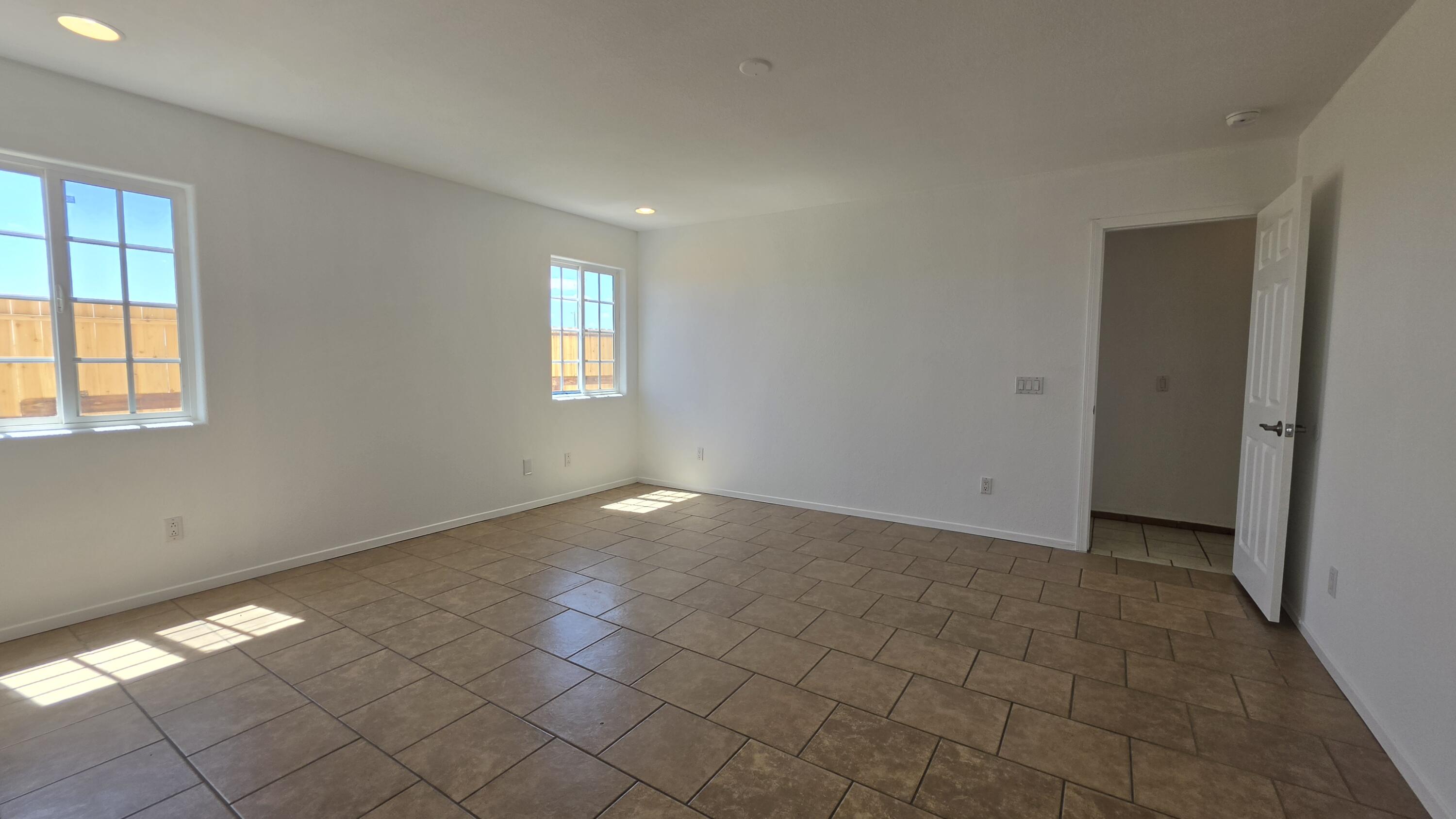 2778 Calhoun Street Thermal, CA 92274 - Photo 19 of 23 an empty room with windows