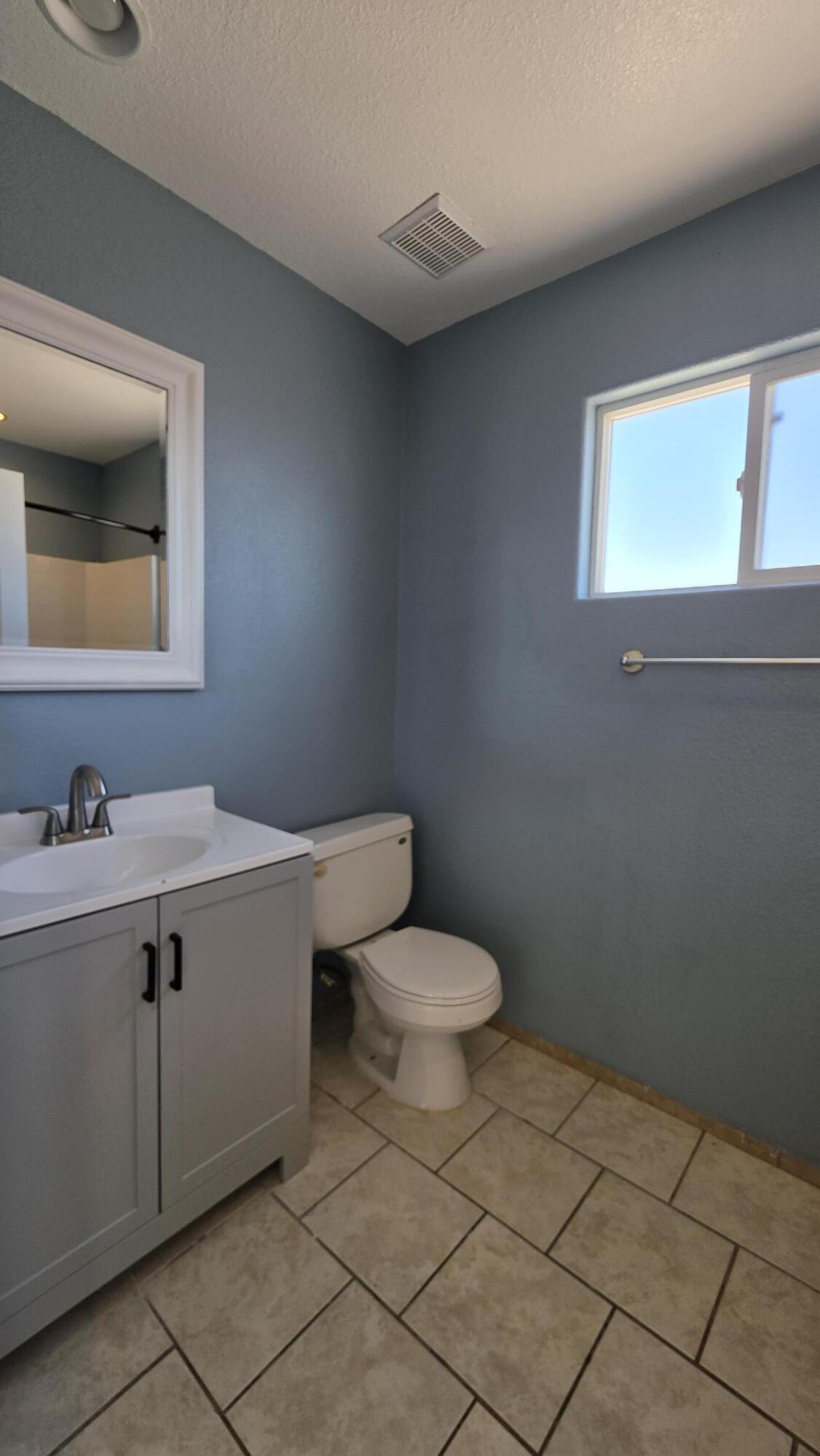 2778 Calhoun Street Thermal, CA 92274 - Photo 22 of 23 a bathroom with a toilet a sink and mirror