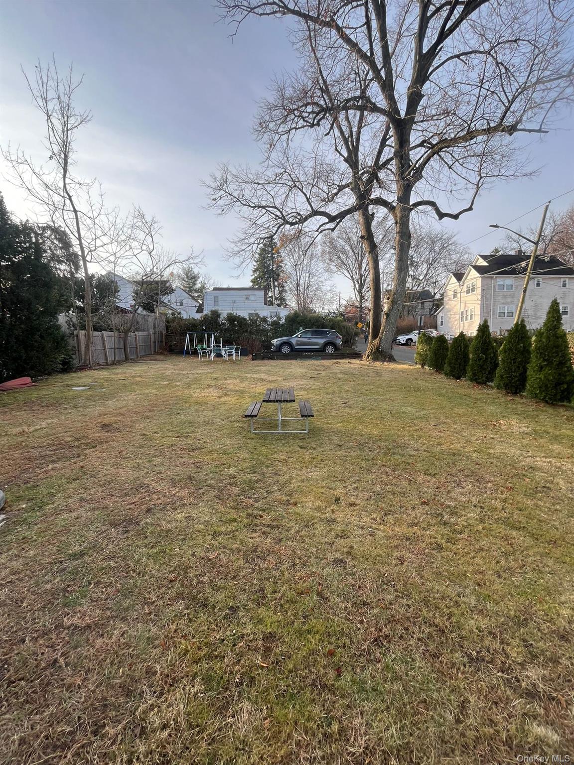 14 Redbrook Road Great Neck, NY 11024 - Photo 20 of 20 a backyard of a house with lots of green space