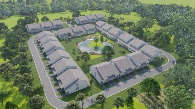 an aerial view of a house with outdoor space and a lake view