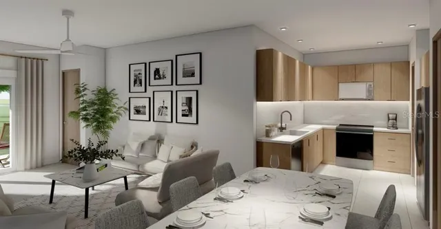 a living room with furniture and a potted plant