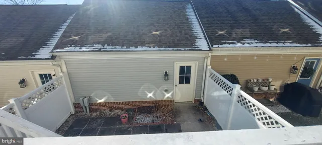 a view of a balcony with chairs