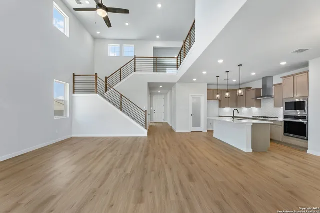 a view of kitchen with cabinets and wooden floor