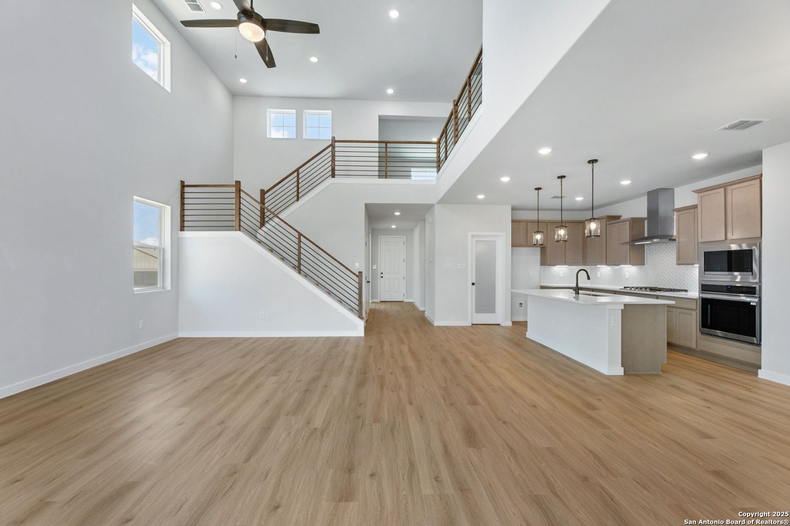 16650 Rosemary Ridge Elmendorf, TX 78112 - Photo 1 of 1 a view of kitchen with cabinets and wooden floor