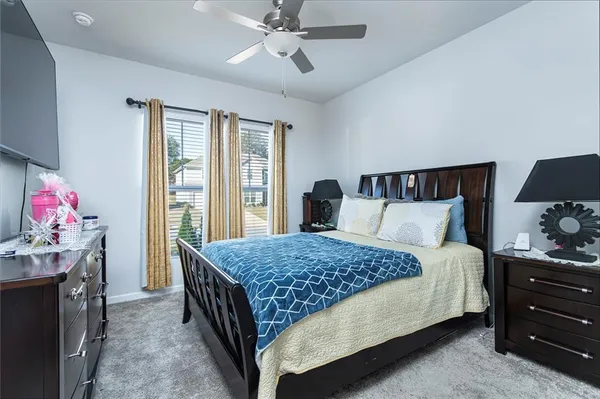 a bedroom with a bed and large dresser