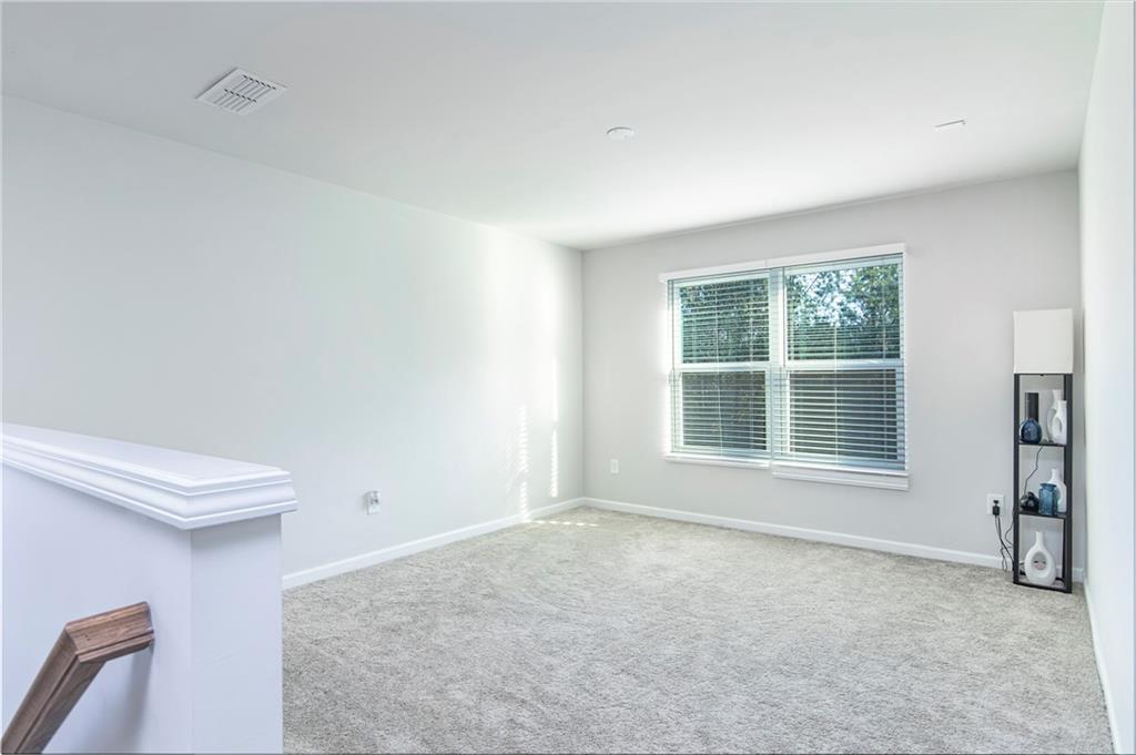 280 Mackenzie Court Covington, GA 30016 - Photo 13 of 24 a view of an empty room with a window
