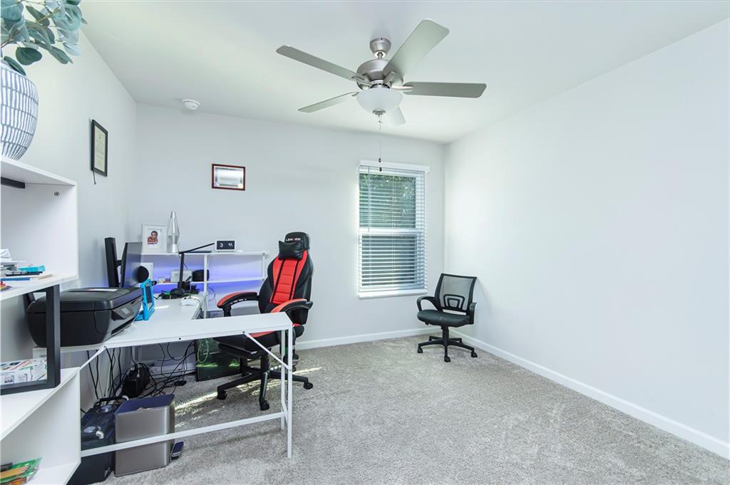 280 Mackenzie Court Covington, GA 30016 - Photo 17 of 24 a workspace with furniture and wooden floor