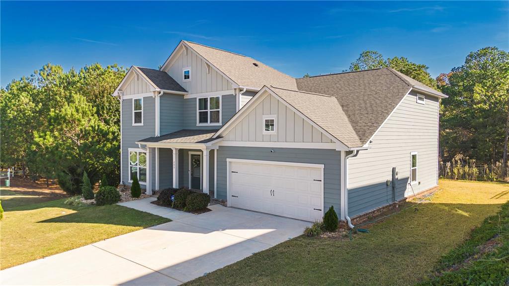 280 Mackenzie Court Covington, GA 30016 - Photo 2 of 24 a view of a house with a yard