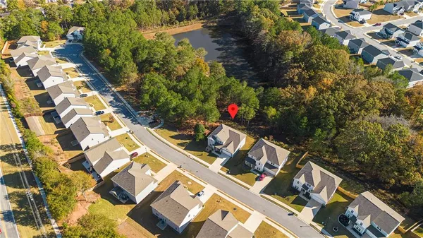 an aerial view of house with yard