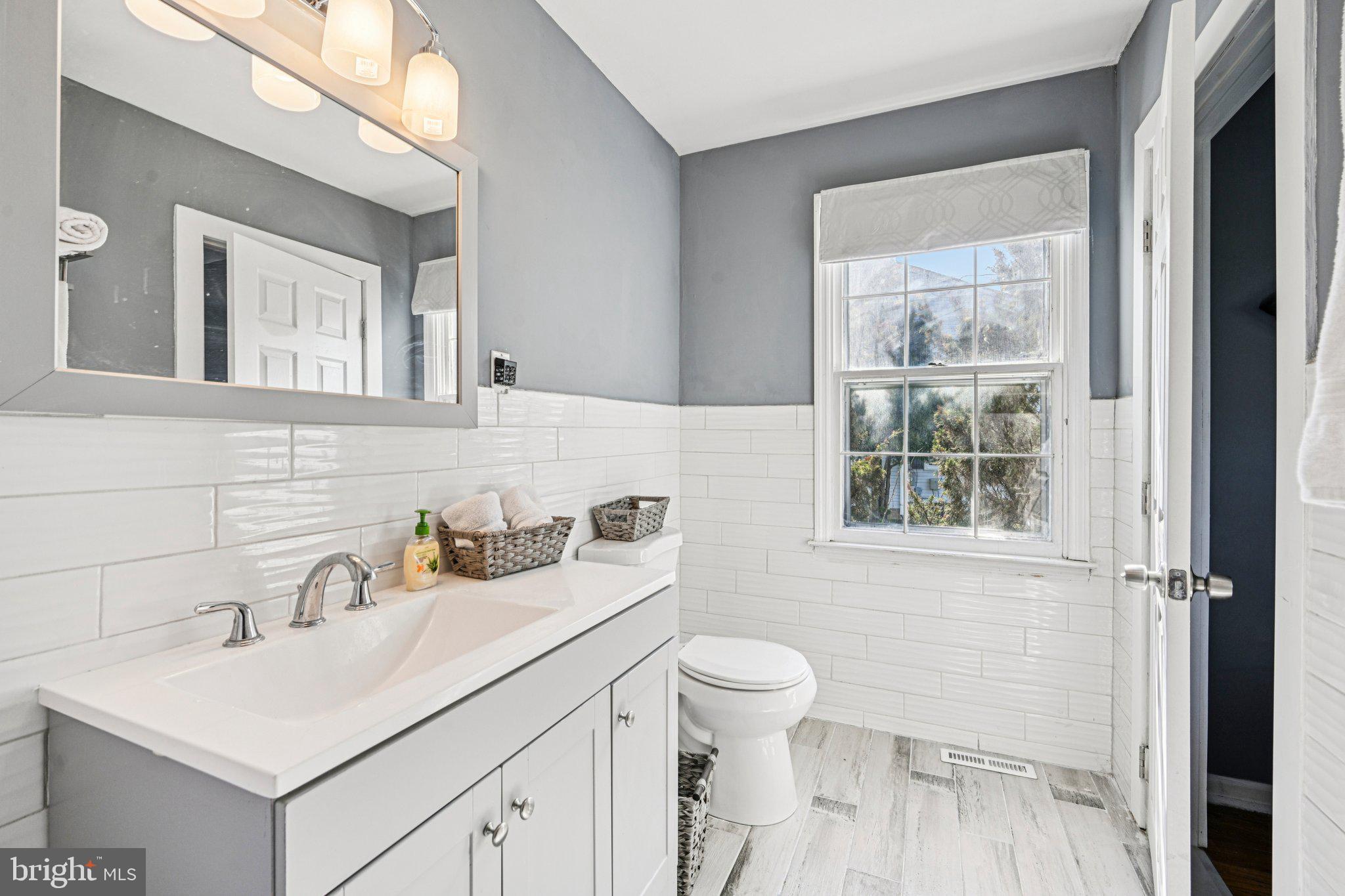 25618 Mt Pleasant Road Columbus, NJ 08022 - Photo 23 of 61 a bathroom with a sink toilet a mirror and shower