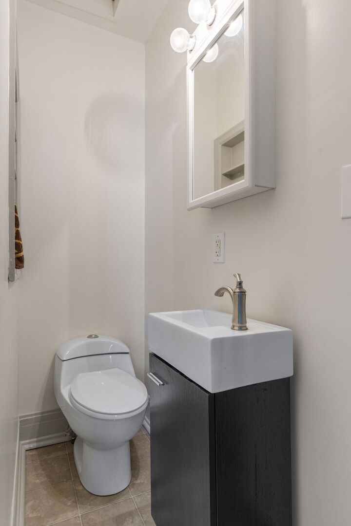 417 North State Street Geneseo, IL 61254 - Photo 29 of 51 a bathroom with a toilet sink and mirror